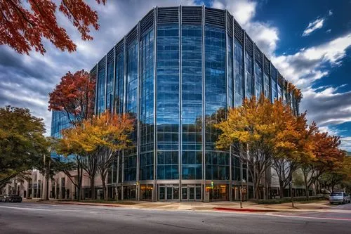 King architectural metal building, Dallas TX, modern skyscraper, sleek metallic façade, reflective glass windows, intricate metal framework, grand entrance, revolving doors, urban cityscape, busy stre