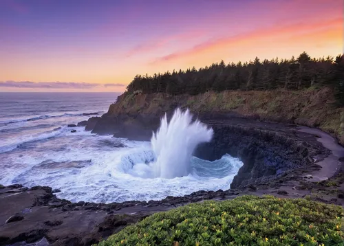 Pacific Ocean waves flow into the remnants of a blowhole at Cape Perpetua on the Oregon coast. Blowholes are essentially skylights in ocean caves. At high tide, water fills the cave and the pressure o