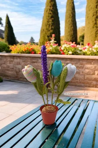 a potted plant with colorful decorations sitting on a table,petunias,garden bench,wooden flower pot,terracotta flower pot,flower bowl,botanical square frame,Small Objects,Outdoor,Garden