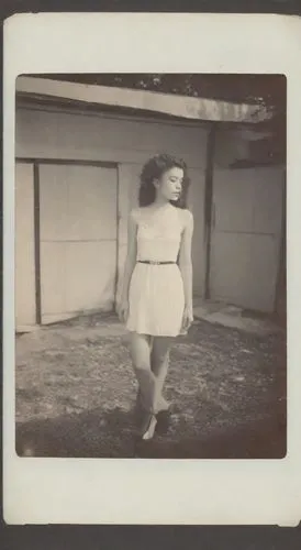 tintype,girl walking away,polaroid photos,woman walking,pinhole,ambrotype,Photography,Polaroid