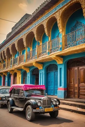 Congolese architecture, colorful buildings, intricate carvings, wooden doors, ornate balconies, vibrant textiles, Kongo people, traditional clothing, head wraps, African patterns, busy streets, Kinsha