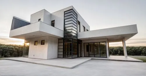 Black House with modern minimalistic architecture big windows and surrounded by nature, in front of house a car and people,modern architecture,modern house,cube house,dunes house,cubic house,contempor