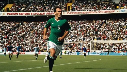 Soccer stadium, sunny day, green grass, white lines, goalposts, soccer balls, scattered on the field, cheering crowd in the background, stadium seats, advertisements boards, electronic scoreboard, lou