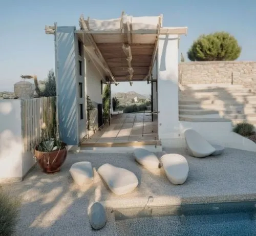 muro in pietra bianco,mykonos,dunes house,outdoor furniture,puglia,outdoor sofa,holiday villa,folegandros,the balearics,lakonos,roof terrace,greece,beach furniture,exposed concrete,exterior decoration