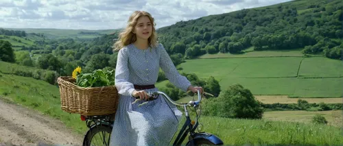 Transport Cassie Ainsworth to a picturesque countryside, where she finds comfort in simplicity and nature's beauty.,woman bicycle,bicycle basket,suitcase in field,wicker basket,bicycle ride,handcart,s