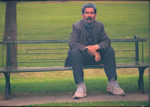 Sitting on a bench, inside the park on a sunny day, people behind,man on a bench,park bench,anton chekhov,homeless man,in the park,kensington gardens,dublin,smoking man,lonliness,bench,notting hill,wa