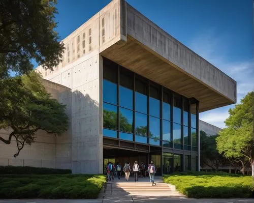 Texas A&M College of Architecture, modern building, brutalist structure, concrete walls, large glass windows, steel beams, column details, ivy-covered facade, American flag waving, students walking, b