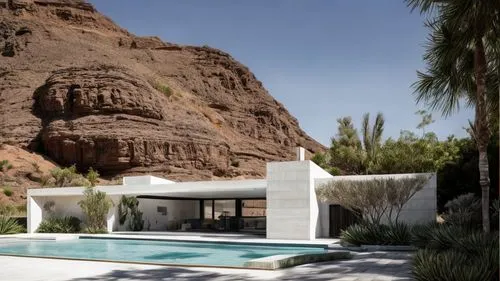 stucco wall,dunes house,pool house,luxury property,cliff dwelling,mid century house,beautiful home,roof landscape,holiday villa,cubic house,stucco,mid century modern,atlas mountains,luxury real estate,exposed concrete,house in the mountains,private house,summer house,palm springs,outdoor pool,Architecture,Villa Residence,Masterpiece,Minimalist Modernism