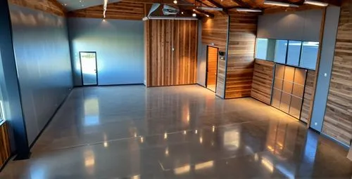 modern recording studio with high angled barn style ceiling, support beams and glass centered structure,hallway space,wood floor,aqua studio,wooden floor,daylighting,wooden sauna,hardwood floors,sauna