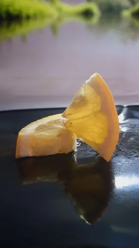 lemon peel,banana dolphin,valencia orange,citrus,orange slice,gelatin,peeled,citrus juicer,half slice of lemon,banana peel,lemon slice,peel,gelatin dessert,slice of lemon,orange slices,sailing orange,surface tension,juicy citrus,kayak,agua de valencia