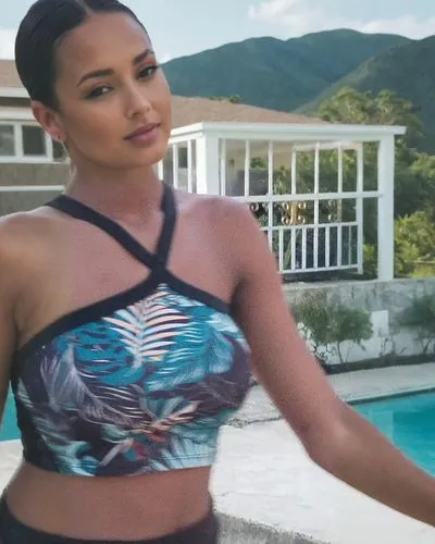 a woman wearing a bikini with palm trees in the background,demi,peyton,demetria,devonne,santana,roimata