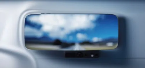 a small screen that is mounted to the side of a car,rearviewmirror,air new zealand,isight,car mirror,blur office background,travelport,Photography,General,Realistic