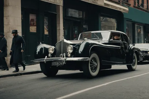 Create a thrilling car chase scene with Ammo NYC battling through the city streets.,mercedes-benz 770,mercedes-benz 500k,daimler 250,daimler majestic major,delage d8-120,bentley 4 litre,vintage cars,m