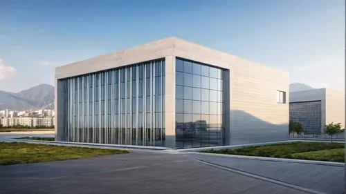 an office building with large windows surrounded by grass,epfl,glass facade,new building,metaldyne,modern building,phototherapeutics,biotechnology research institute,office building,embl,newbuilding,b