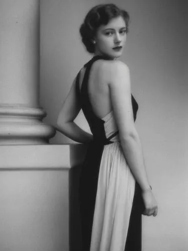 A lady from the 1940s in front of a classical column.,a woman in a long dress leans against a pillar,ziegfeld,olivia de havilland,stanwyck,garbo,ingrid bergman,lansbury,Photography,Black and white pho