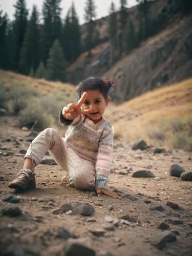 an adorable little girl making a peace sign with her hand,naqeeb,pakistani boy,gekas,photographing children,mohsin,bhanja,yemeni,sarhadi,idrees,uzair,naqib,zayyad,ayaan,yemenis,fayyad,cute baby,abdelr