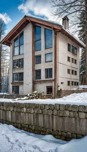 A large three-story house prepared for a zombie apocalypse in a place that has a deep river, a forest and lots of snow around this house. And it also has a concrete wall and a reinforced gate.,ludwig 