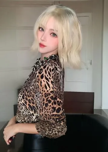 a woman poses in a short white wig,cheetah print,algan,cruella,blondie,darci,natashquan