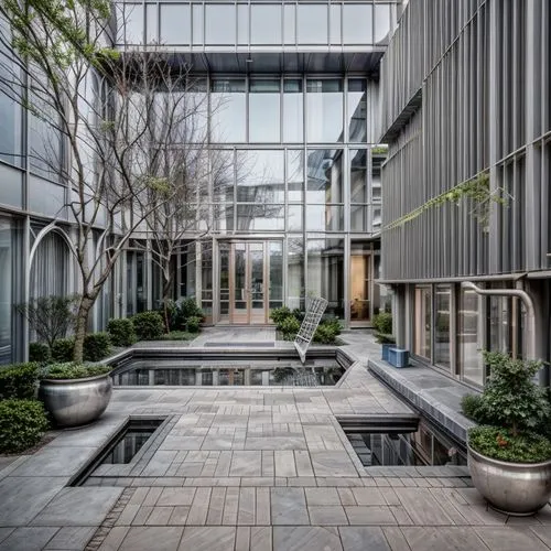 courtyard,office buildings,modern office,business school,glass facade,office building,corporate headquarters,company headquarters,landscape designers sydney,glass facades,landscape design sydney,inlet