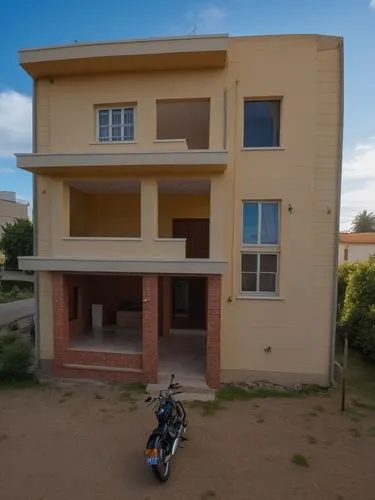 a motorcycle parked outside an apartment in a desert area,dodoma,appartment building,ouagadougou,bamako,elderhostel,djougou,Photography,General,Realistic