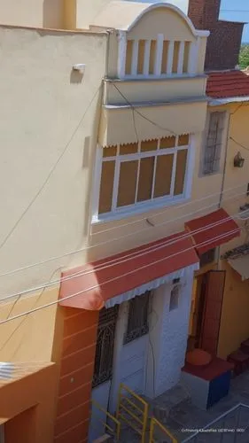 view from the roof looking down at the building and its courtyard,oia,kavala,lakonos,paros,tinos island pyrgos,kalymnos,Photography,General,Realistic