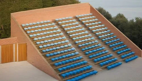 [11:21] Marco De Torres
A grandstand with 3,000 seats, featuring blue plastic chairs arranged in 7 rows with 3 access points.
 ,solar batteries,solar battery,solar modules,solar panel,solar panels,pho