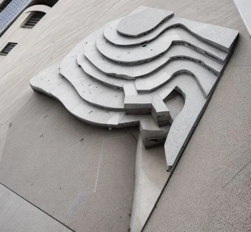 brutalist architecture,concrete construction,reinforced concrete,fontana,architectural detail,superman logo,concrete,facade panels,public art,art deco,art deco ornament,toronto city hall,steel sculptu