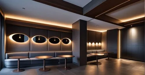 Food and beverage space in a wine store. Overall dark atmosphere. Dark gray fabric sofa and indirect lighting below. The wall of the sofa is a built-in cabinet where wine is displayed. Lighting on top