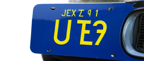 Blue and yellow license plate, rectangular shape, embossed letters and numbers, glossy finish, reflective surface, slight curve, attached to car bumper, morning light, shallow depth of field, vibrant 