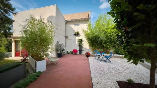 a back yard with a hammock set up on the ground,courtyard,courtyards,villaggio,fresnaye,patios,casalesi