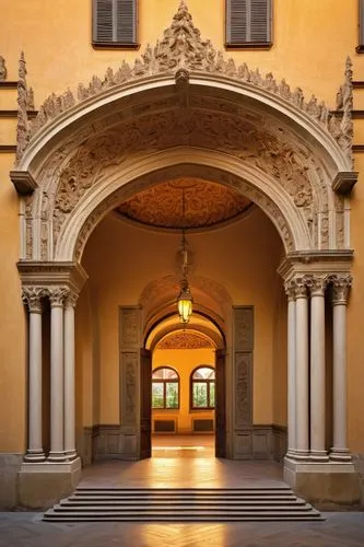 Renaissance-style palace, Florence, Italy, grandiose entrance, ornate stone carvings, intricately designed arches, columns adorned with sculpted capitals, terracotta rooftops, decorative balconies, or