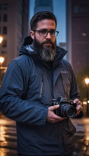 Male photographer, 35yo, bearded, glasses, casual outfit, camera equipment, Philadelphia cityscape, modern skyscrapers, historic buildings, Independence Hall, Liberty Bell, night scene, streetlights, 