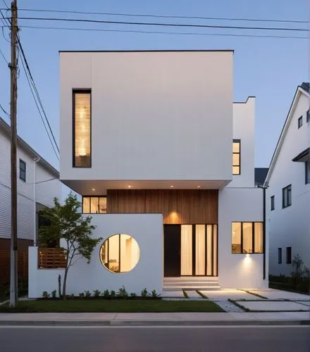 a modern residence.
Some people on the road.,a modern white house is pictured in this evening s,cube house,cubic house,house shape,modern house,modern architecture,frame house,Photography,General,Real