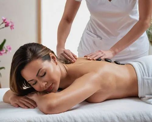 Female masseuse Massaging a young woman who is lying face down on the bed.,relaxing massage,thai massage,massage therapist,massage,massage therapy,china massage therapy,massage table,cardiac massage,s