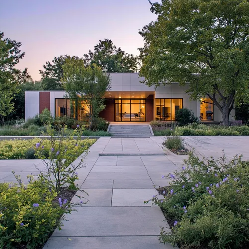 1building,the walkway is next to a large building with lights on,mid century house,mid century modern,amagansett,bridgehampton,ruhl house,neutra,modern house,paved square,dunes house,landscaped,eichle