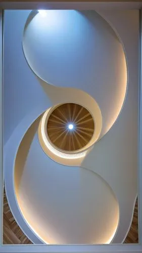 Gypsum decoration in the ceiling of a room with hidden LED lighting,an artful circular room features decorative lighting and a chandelier,circular staircase,spiral staircase,spiral stairs,ceiling ligh