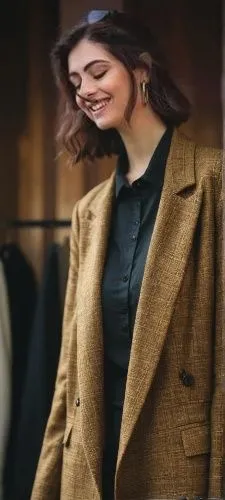 дрехи,the woman is standing near clothes and smiling,woman in menswear,hande,peacoat,maxmara,boschi,coat