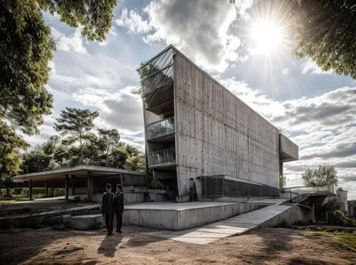 two people standing next to each other near a building,salk,corbu,cubic house,siza,hejduk,zumthor,Architecture,General,Brutalist,Brutalism