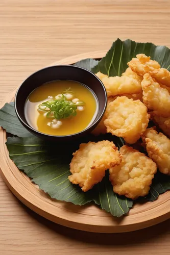 Describe the crunchy texture and savory taste of tempura.,pisang goreng,tostones,japanese tempura,crab rangoon,satay celup,tahu goreng,hokkaido soup ginger,tempura,shrimp tempura,fried fritters,fried 