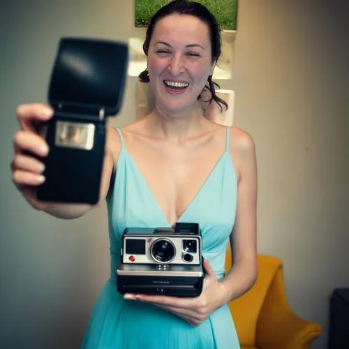 instant camera,twin lens reflex,vintage box camera,vintage camera,halina camera,woman holding a smartphone,twin-lens reflex,box camera,digital camera,point-and-shoot camera,disposable camera,analog ca