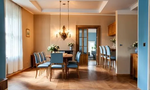 dining room, classic wall panels, lots of details, chandelier, fireplace with fire, open to below,a nice dining room with hard wood floors and blue chairs,dining room,breakfast room,tikkurila,danish r