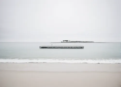 Artur - Tranquil beach - Capture a serene seaside view.,breakwater,lake freighter,livestock carrier,st ives pier,landing craft,the old breakwater,freighter,grey sea,landing craft mechanized,longexposu