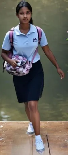 a  walking along the side of a river carrying a backpack,akhila,vasanthi,bhargavi,shailaja,jyothi,gopika