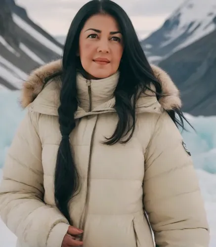 A woman with long black hair, dark brown eyes, and natural makeup,the polar circle,nunatak,arctic,arctic ocean,greenland,eskimo,arctic antarctica,sarplaninac,north pole,khuushuur,alaska,baffin island,