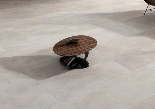 A dark wood coffee table with a concave top design ,ceramic floor tile,tile flooring,flooring,floor tiles,clay floor,stone floor,laminate flooring,wood flooring,wood floor,parquet,wooden floor,ceramic