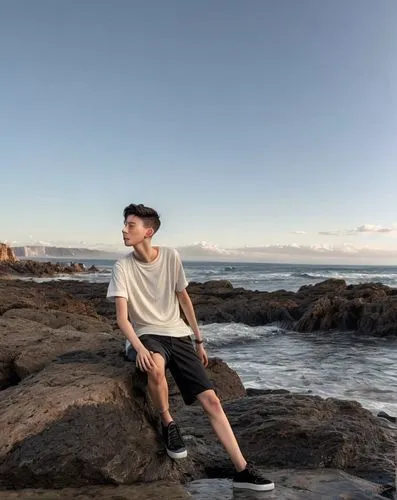 Troye sivan, buzz cut, low fade, youth adult, xs, man, black hair, uhd, 4k, hyper realistic,coogee,maroubra,mona vale,byron bay,bondi beach,beach background,bondi,meditating,man at the sea,sunset clif