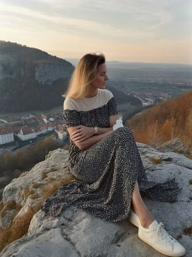 a foreign woman in white trainers on the Burgstein rock high above Unterhausen.,the girl is sitting on a rock near a scenic town,mikulov,piatra,znojmo,idrija,iulia hasdeu castle,golubac,Photography,Do