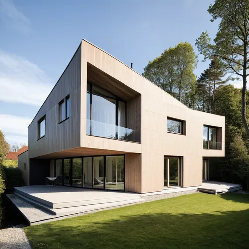 A villa exterior with a parametric facade in neutral tones 
,modern house,modern architecture,cubic house,dunes house,housebuilding,residential house,frame house,house hevelius,danish house,timber hou