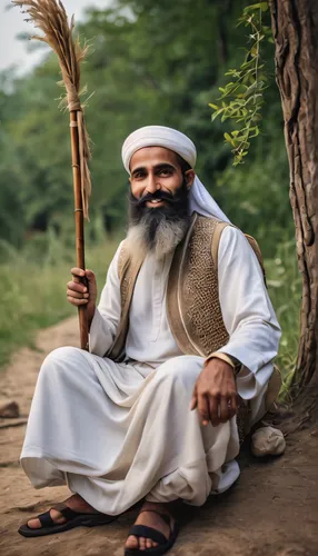 A Muslim sheikh with a long beard, his eyes are blue, carrying a stick in his hand sitting in nature and next to him are children who listen to him, his smile is nice,mandaeans,munarman,moulavi,balkhi