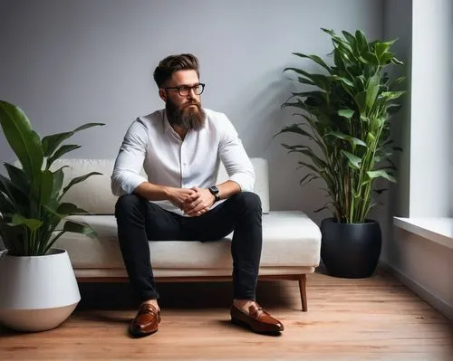 Interior design photographer, male, 30s, casual style, messy brown hair, black frame glasses, beard, white shirt, dark jeans, brown loafers, holding DSLR camera, studio strobe light, modern minimalist